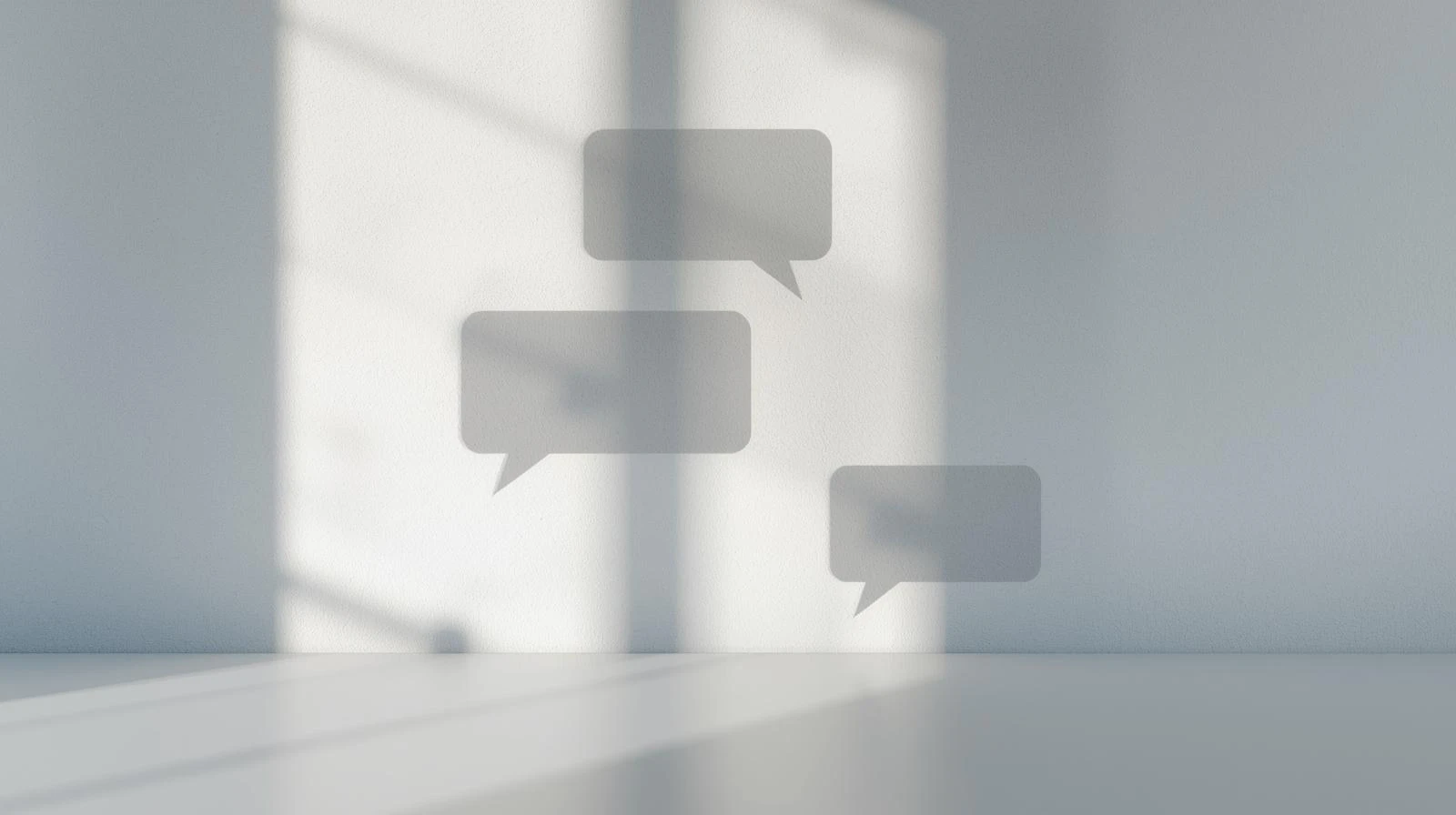 Chat message icons casting shadows on wall symbolizing multi-channel feedback